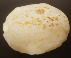 Paleo flatbread poofed up when cooking