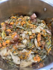vegetable scraps simmering in stockpot