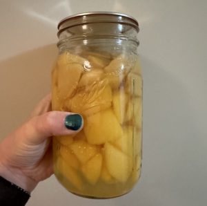 canned peaches in a jar