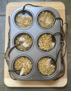 chicken treats on a cutting board before going into the freezer