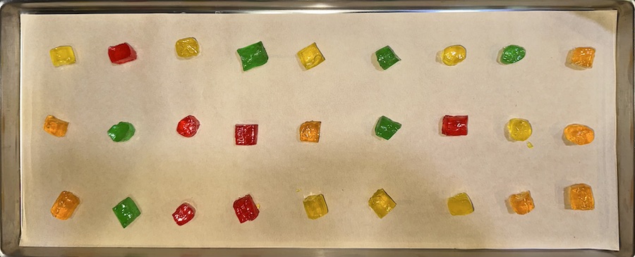 tropical Jolly Ranchers cut in half on freeze dryer tray